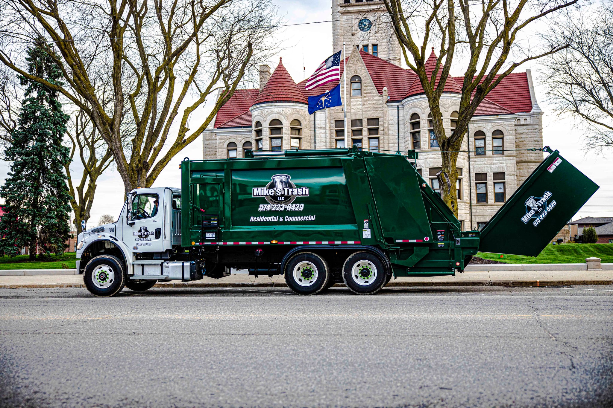 Mike's Trash truck on street